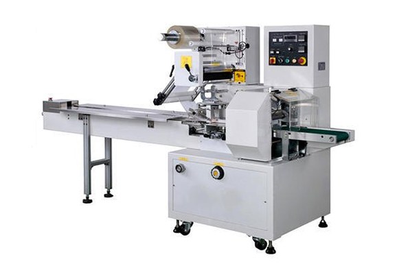HORIZONTAL FLOW WRAPPING MACHINE